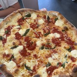 Pizzeria Rubino signature dishes The Rubino (pepperoni, sausage, mushrooms, onions), Margherita Pizza, The Wise Guy (white pizza with ricotta and garlic)